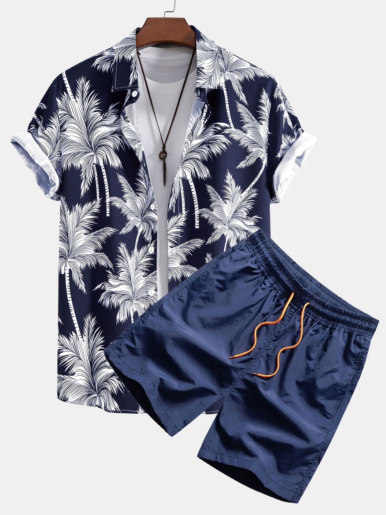 Skjorte med knapp og badeshorts med palmetreprint