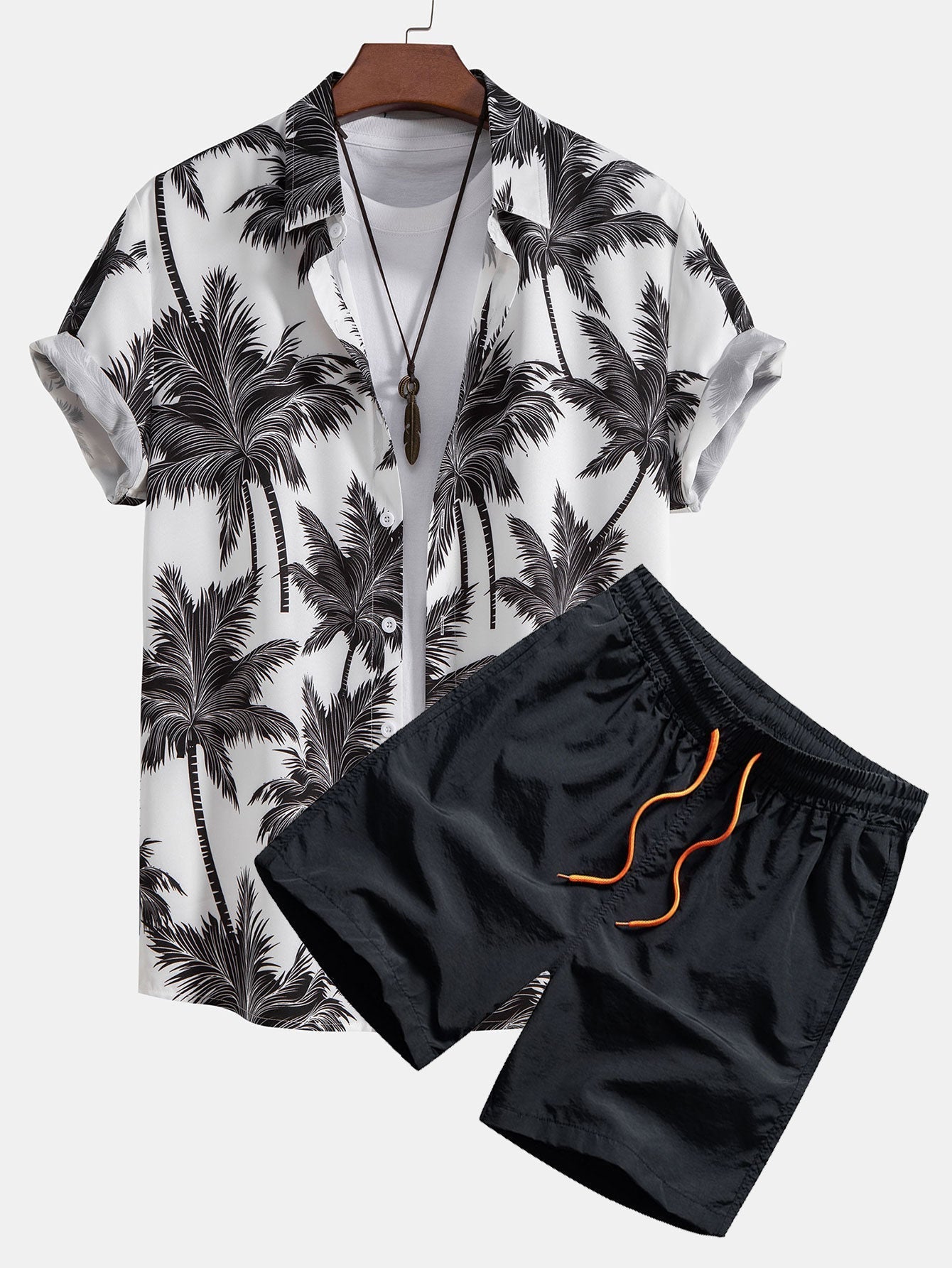 Skjorte med knapp og badeshorts med palmetreprint