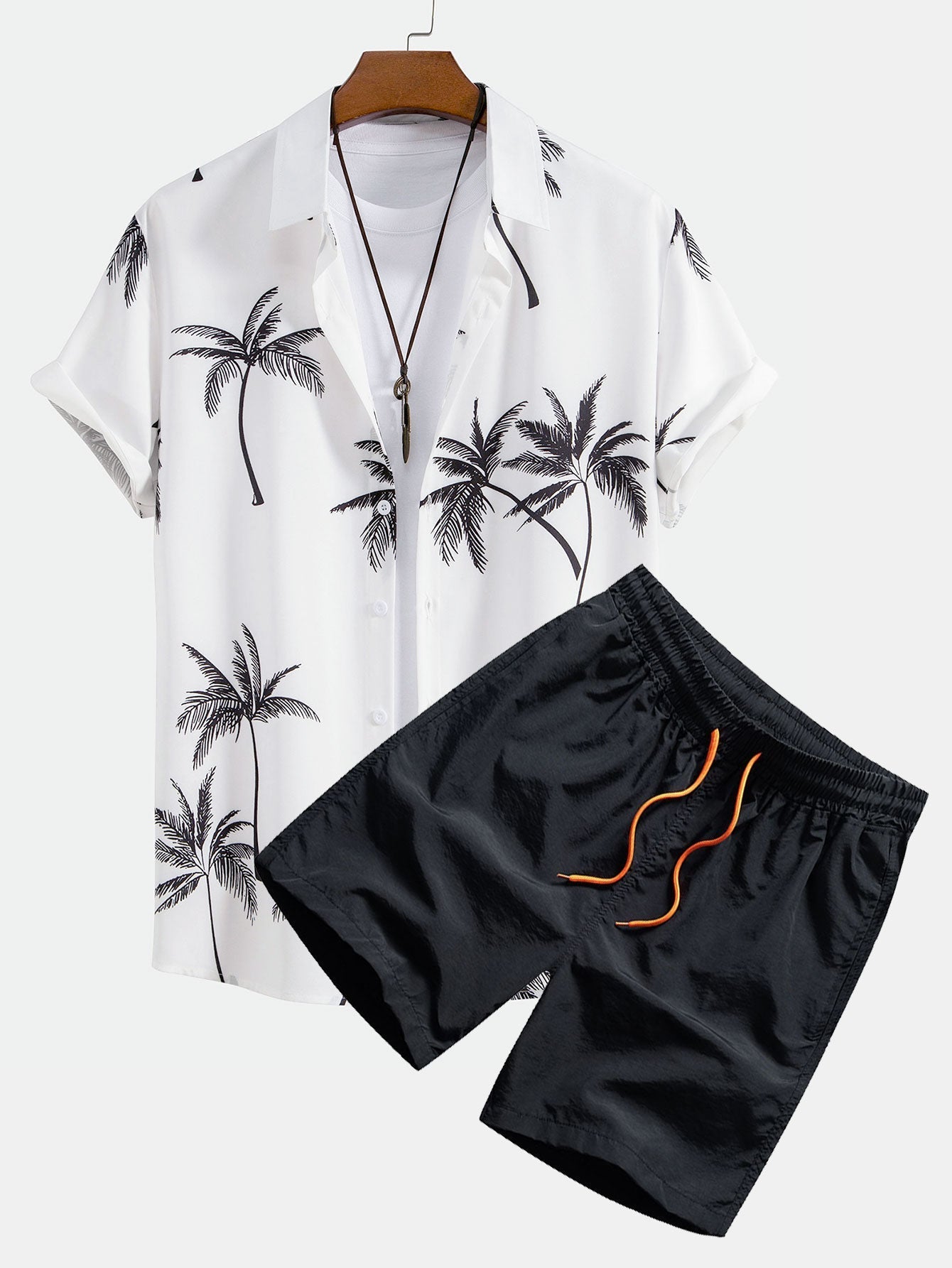 Skjorte med knappelukking og badeshorts med palmemønster