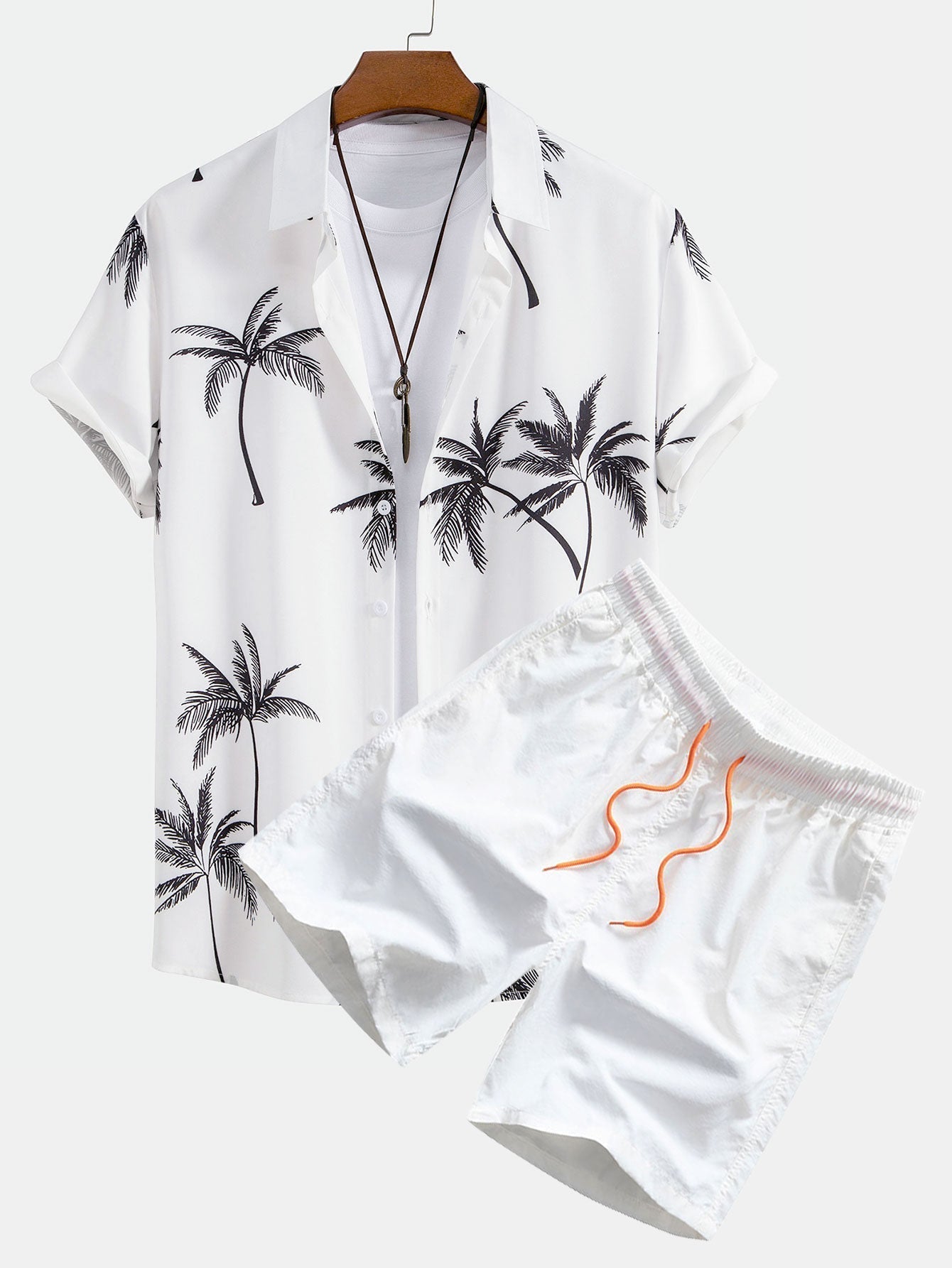 Skjorte med knappelukking og badeshorts med palmemønster