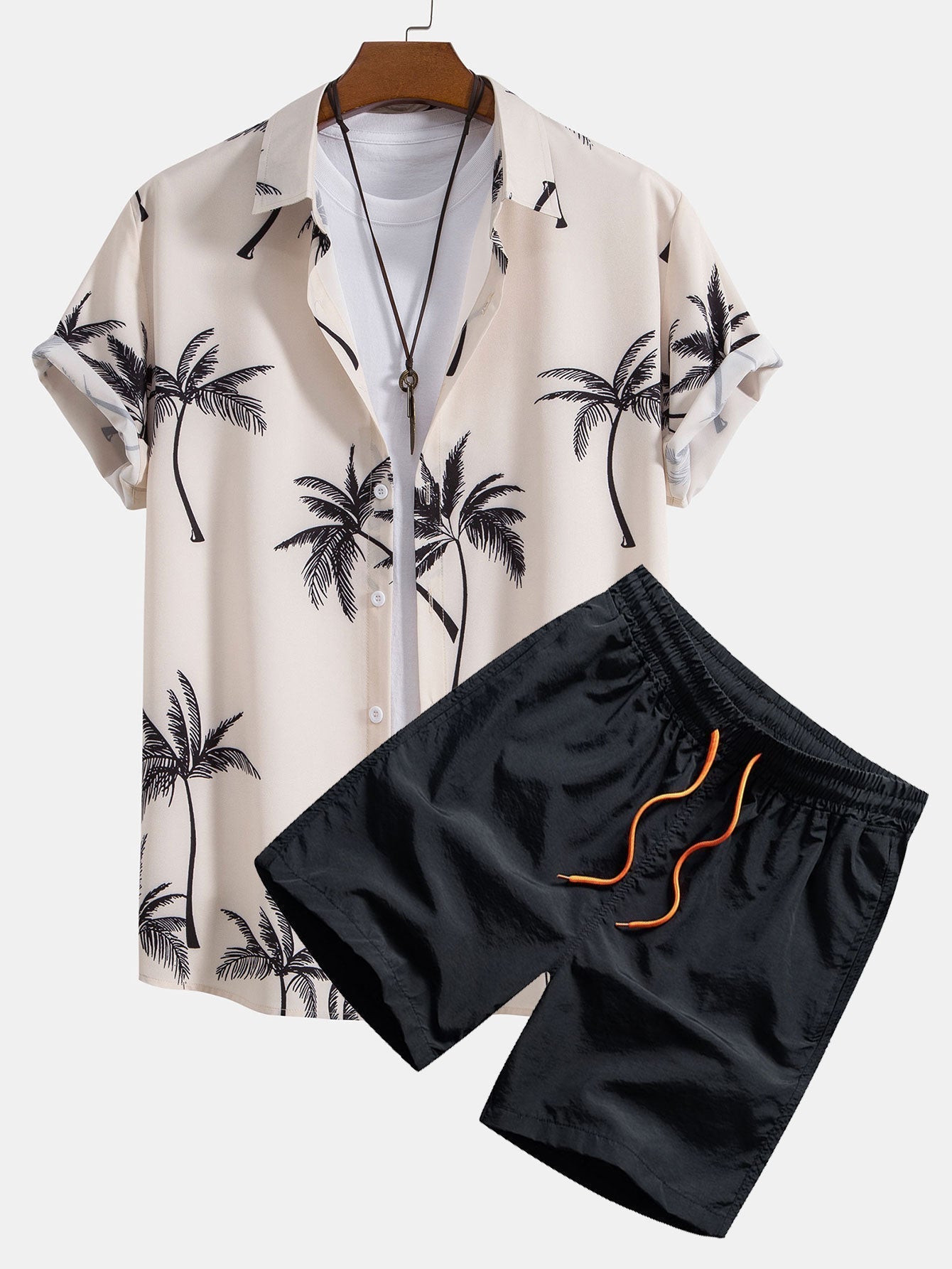 Skjorte med knappelukking og badeshorts med palmemønster