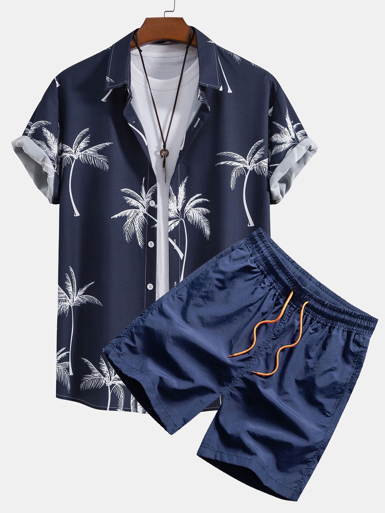 Skjorte med knappelukking og badeshorts med palmemønster