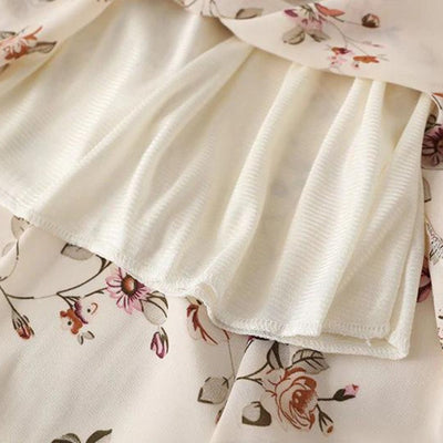 Elegant midikjole med blomstertrykk