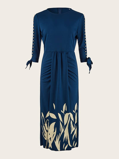 Elegant kjole med perlebesatte ermer