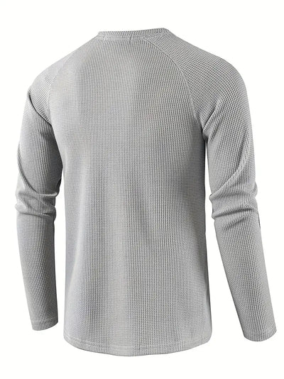 Elegant, ensfarget, langermet poloskjorte for menn