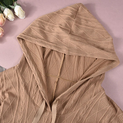 Strukturert jumpsuit med hette og lommer foran