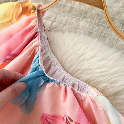 Blomstret kjole med halterneck og volanger