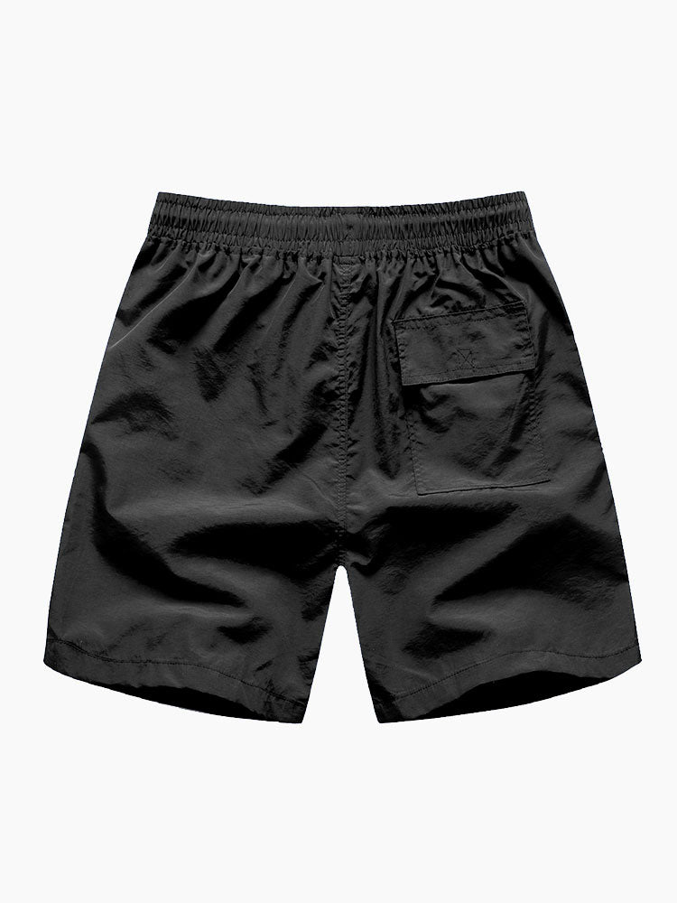 Skjorte og badeshorts med geometrisk fargeblokk og knapptrykk