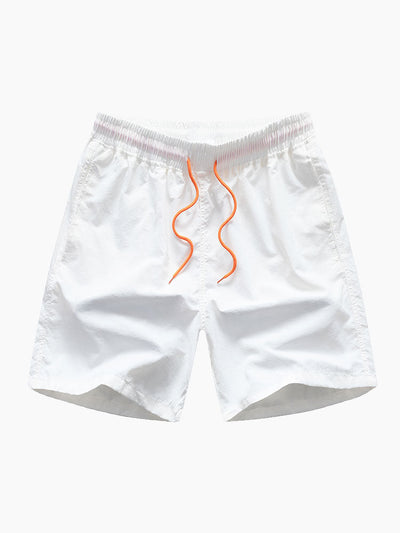 Skjorte med flamingoknappslå og badedrakt med tropisk mønster