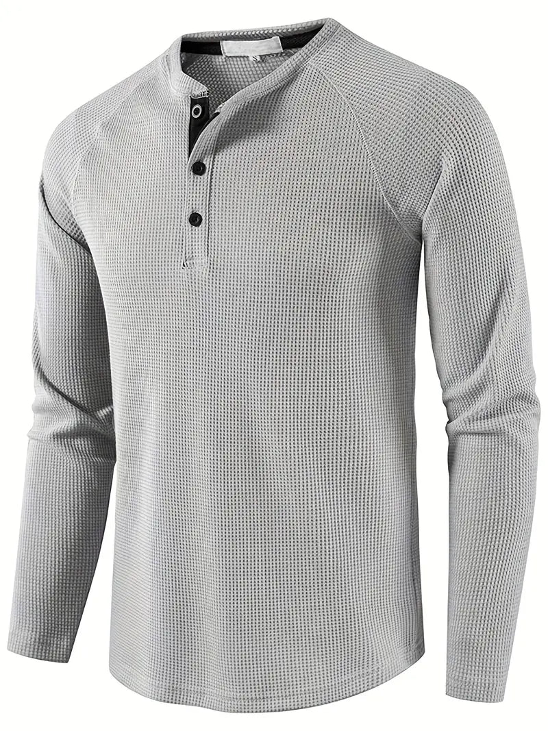 Elegant, ensfarget, langermet poloskjorte for menn