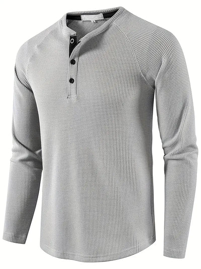 Elegant, ensfarget, langermet poloskjorte for menn