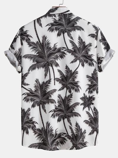 Skjorte med knapp og badeshorts med palmetreprint